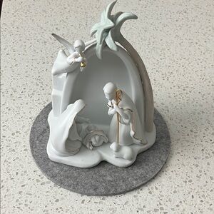 White Ceramic Nativity Sculpture with Gold Accents